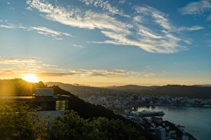 Wellington Prints: The sun sets over a new home atop Mount Victoria in Wellington, North Island, New Zealand