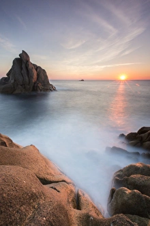 Capo Testa Prints: The sun setting behind the rocks of the peninsula of Capo Testa