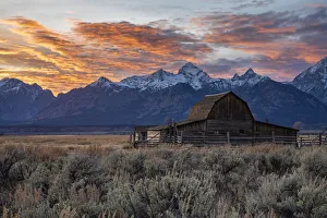Sun setting over the Teton Range at Moulton Barn, Grand Teton National Park, Wyoming