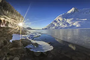 Lago Bianco Prints: The sun shining through icicles formed on the shores of Lago Bianco at Bernina