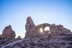 Sunburst through Turret Arch, Arches National Park, Utah, United States of America