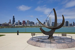 Sundial sculpture at the Adler Planetarium and city skyline, Chicago, Illinois Sundial sculpture at the Adler Planetarium and city skyline, Chicago, Illinois