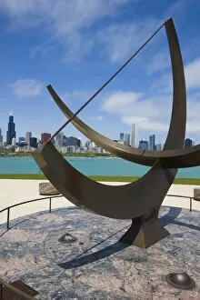 Sundial sculpture at the Adler Planetarium sundial and city skyline, Chicago