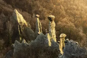 Brescia Province Prints: Sunlight illuminates earth pyramids (rock chimneys) of Zone, Zone, Brescia province