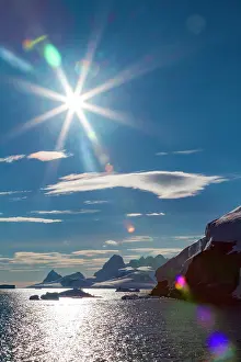 Season Prints: Sunlight reflects on icebergs and mountains in Paradise Bay, Antarctica
