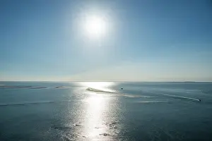 Atmosphere Prints: Sunlight reflects on the ocean surface near the lighthouse of Cordouan in France during the daylight hours