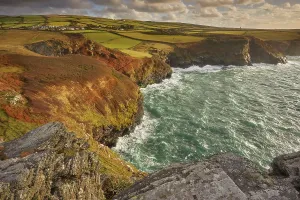 Great Prints: Sunlight shines on cliffs near Boscastle from Willapark headland on the Atlantic coast of Cornwall in Great Britain