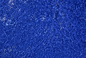 Sunlight sparkling on blue water