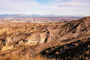 Granada Prints: Sunlit ridges and valleys create patterns in the landscape of Desierto de Gorafe in southern Spain