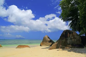 Relax Prints: Sunny day at Beau Vallon Beach with rocks and clouds over the water in Seychelles