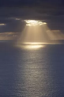 Sunrays over the ocean, west coast of Sandoy, Faroe Islands (Faroes), Denmark, Europe