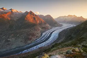 Swiss Prints: Sunrise over Aletsch Glacier in summer with mountains surrounding the landscape
