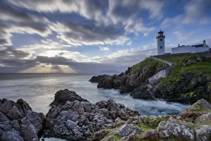 County Donegal Prints: Sunrise over the Atlantic Ocean and Fanad Head Lighthouse in County Donegal Ireland