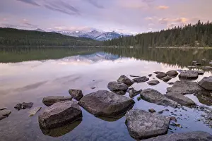Sunrise on a beautiful reflective lake in the Canadian Rockies, Jasper National Park