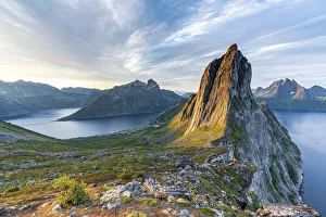 Sunrise over the clear water of the fjord and Segla mountain, Senja island, Troms county
