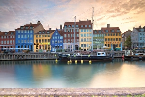 Nyhavn Prints: Sunrise on the colourful facades along the harbour in the district of Nyhavn, Copenhagen