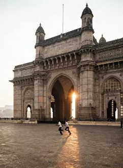 Typically Indian Gallery: Sunrise behind The Gateway to India, Mumbai (Bombay), India, South Asia