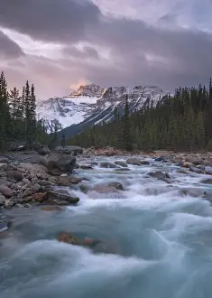 Sunrise and glacial blue rushing waters at Mistaya Canyon, Banff National Park, UNESCO