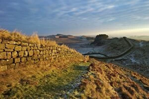 Fortification Gallery: Sunrise and Hadrians Wall National Trail in winter, looking to Housesteads Fort, Hadrians Wall