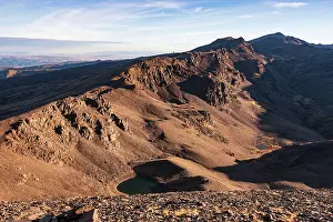 Mountainous Prints: Sunrise over high alpine tarn in Sierra Nevada National Park with Cerro del Caballo in background