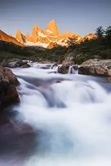 Sunrise Mount Fitz Roy (Cerro Chalten) and waterfall seen on Lago de los Tres hike