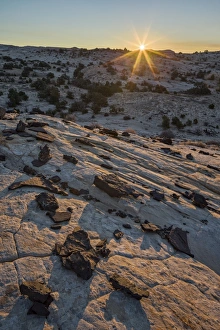 Lava Prints: Sunrise above Navajo sandstone and lava chunks