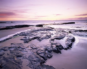 Sunrise over North Sea from Bamburgh beach, Bamburgh, Northumberland, England