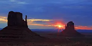 Navajo Prints: Sunrise over the red rock formations in Monument Valley in Navajo Indian Territory in Utah