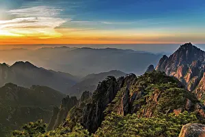 Province Prints: Sunrise reveals mountain peaks and valleys in Huangshan in Anhui Province, China