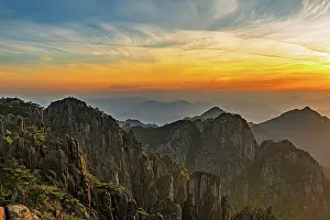 Rising Prints: Sunrise over the rocky peaks and valleys of Huangshan Mountain in Anhui Province, China