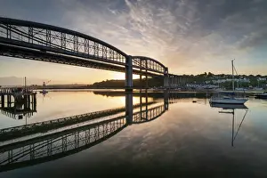 Sunrise over the Royal Albert Bridge which spans the River Tamar in Saltash, Cornwall, England, United Kingdom, Europe
