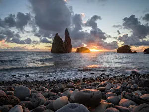 Pebble Prints: Sunrise below sea stacks from the pebble beach of Bahia da Alagoa