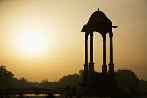 Images Dated 23rd March 2008: Sunrise silhouettes a chhattri in New Delhi, India, Asia
