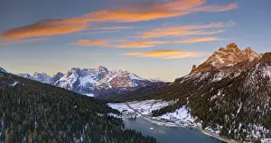 Pine Tree Prints: Sunrise over the snowy woods surrounding Lake Misurina and Sorapis, aerial view