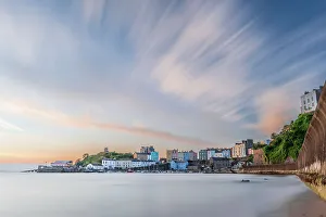 Fishing Village Prints: Sunrise over Tenby's harbour on a calm summer morning