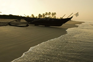 Benaulim Prints: Sunrise over traditional fishing boat and beach, Benaulim, Goa, India, Asia