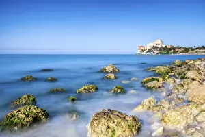 Stony Prints: Sunrise on turquoise sea frames the medieval Falconara Castle