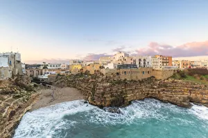Sunrise with view on the beach of Lama Monachile from above, Polignano a Mare, Apulia
