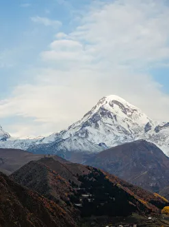 Sunrise view of Gergeti Trinity Church and Mount Kazbek, Kazbegi, Georgia (Sakartvelo)
