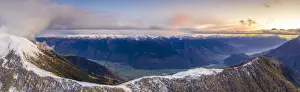 Sunset on the autumnal landscape of Scermendone Alp and Orobie Alps, aerial view by drone