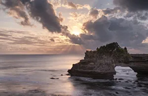 Batu Bolong Prints: Sunset on Batu Bolong temple on a natural arch in the sea, Bali, Indonesia