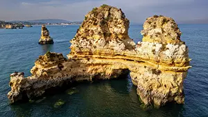 Geological Prints: Sunset over beach cliffs with ocean view in Algarve creating beautiful natural scenery near Lagos in Portugal