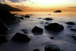 Relax Prints: Sunset at Beau Vallon beach with rocks and calm water in Seychelles
