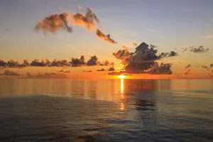 Sunset over beautiful calm sea, interesting clouds, vibrant colours, St. Kitts, St