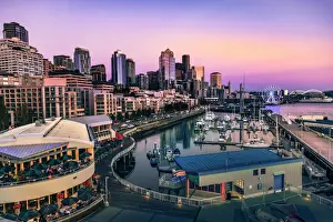 Seattle Prints: Sunset over Bell Harbor Marina on the Seattle Waterfront with citys skyline in the background