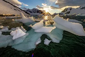 Danco Island Prints: Sunset over bergy-bits of ice off the shore of Danco Island, Antarctica, Polar Regions