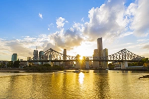 Sunburst Prints: Sunset, Brisbane city with the sun hidden behind the Story Bridge, Brisbane, Queensland