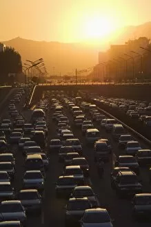 Sunset over city ring road during rush hour, Beijing, China, Asia