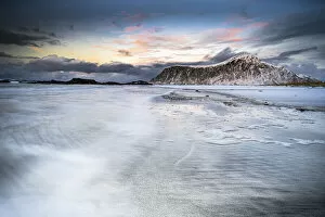 Nordland County Gallery: Sunset over frozen waves of the Arctic Sea, Skagsanden beach, Flakstad, Nordland county