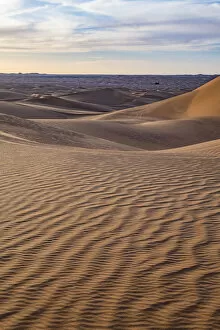 Rippled Gallery: Sunset in the giant sand dunes of the Sahara Desert, Timimoun, western Algeria, North